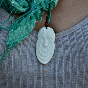 Hand Carved Full moon White Wolf Pendant